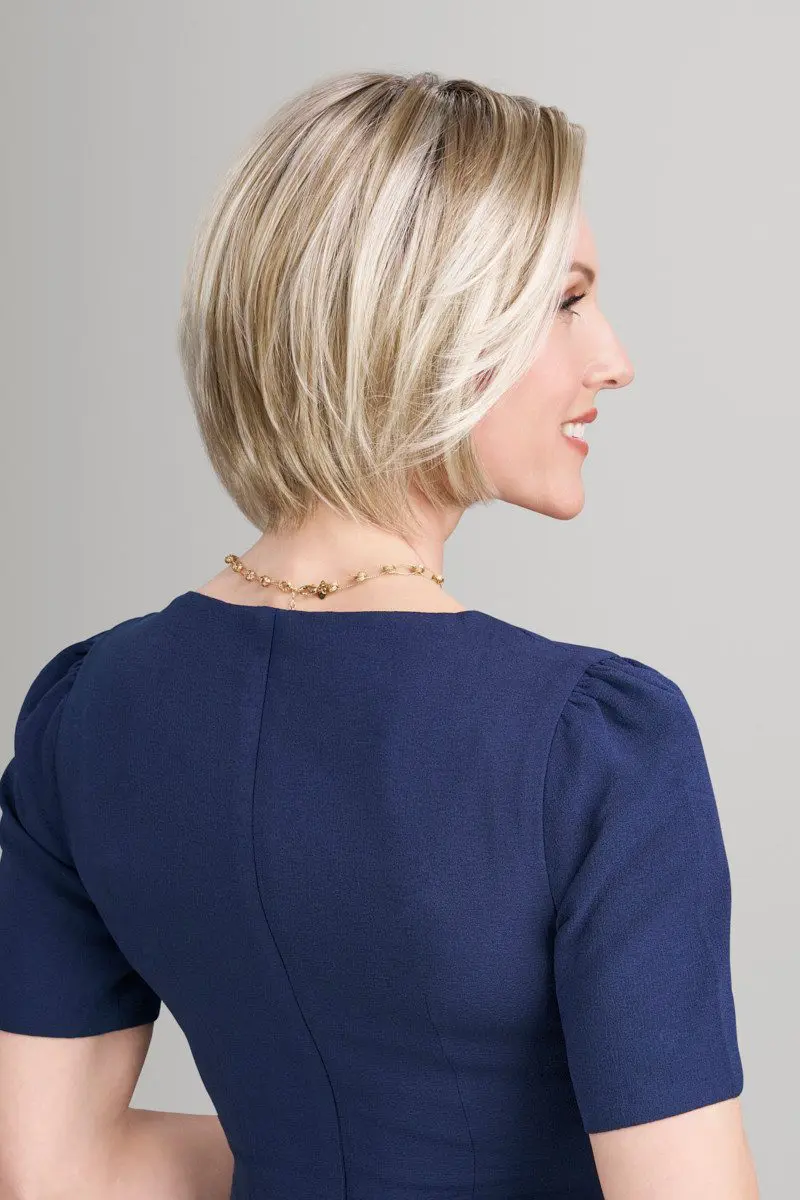 Woman with short blonde hair in profile.