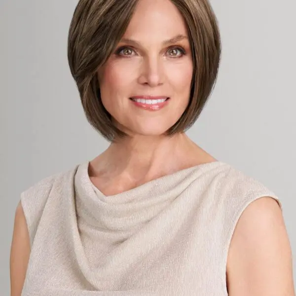 Smiling woman with short brown hair.