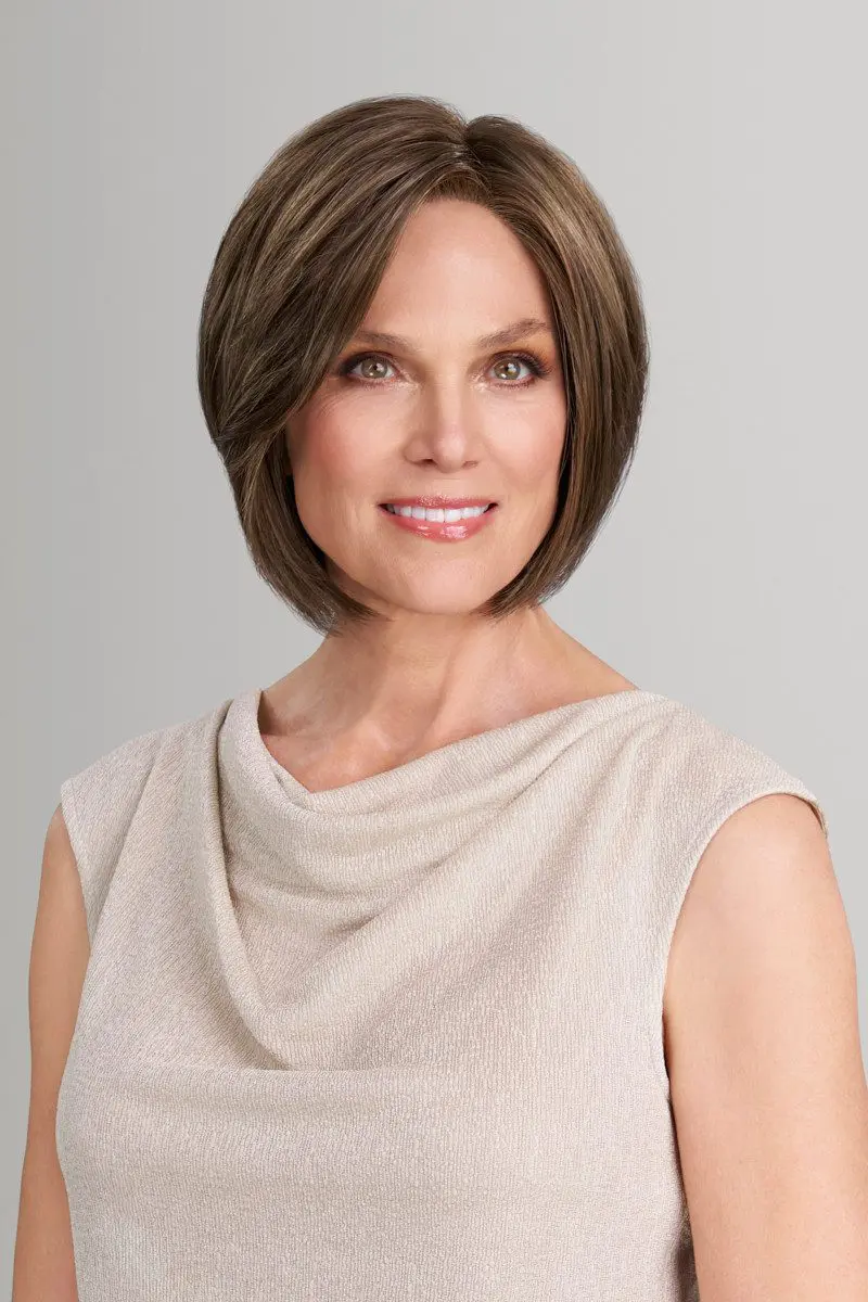 Smiling woman with short brown hair.