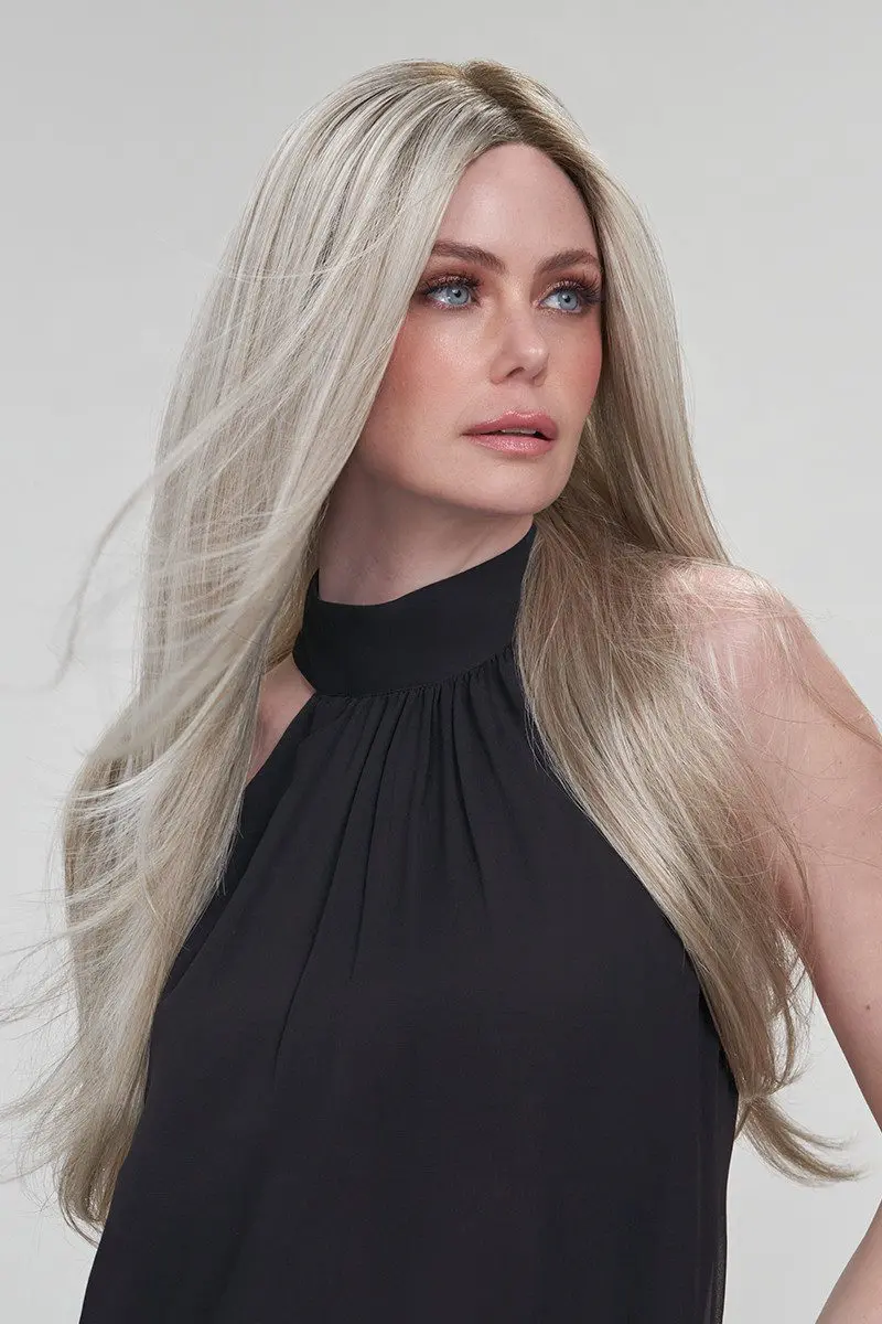 Woman with long blonde hair, black top.