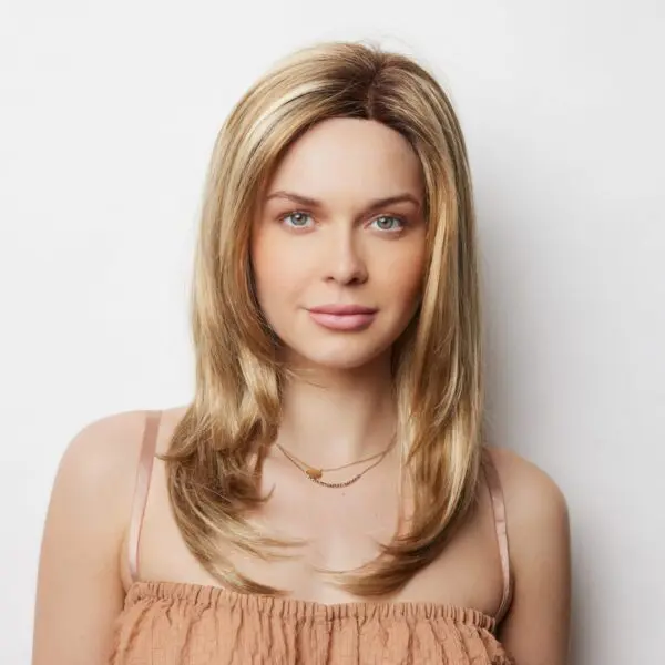 Woman with long blonde hair smiling.