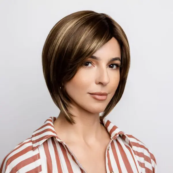 Woman in striped shirt with short hair.