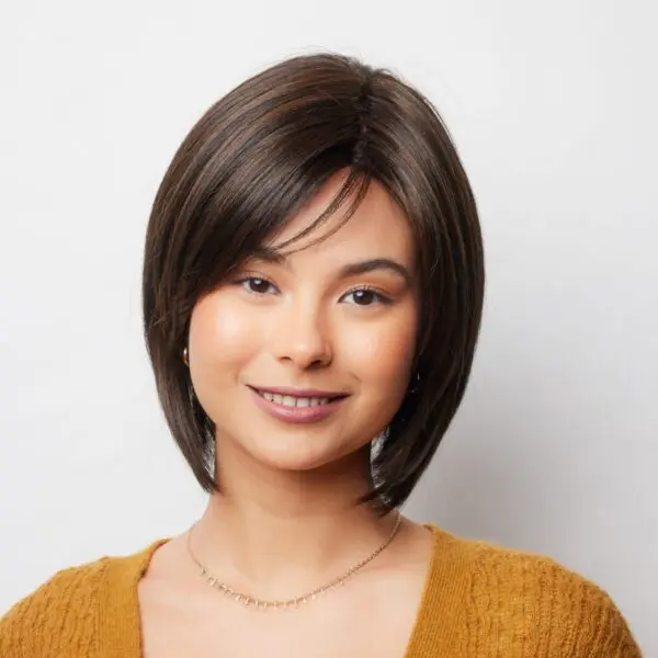 Smiling woman with short brown hair.