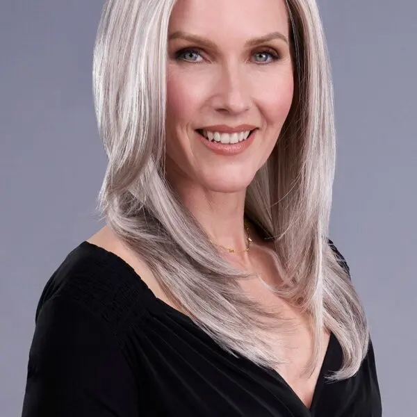 Smiling woman with long gray hair.