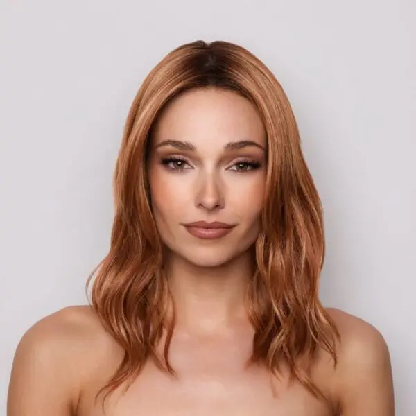 Woman with long, wavy brown hair.