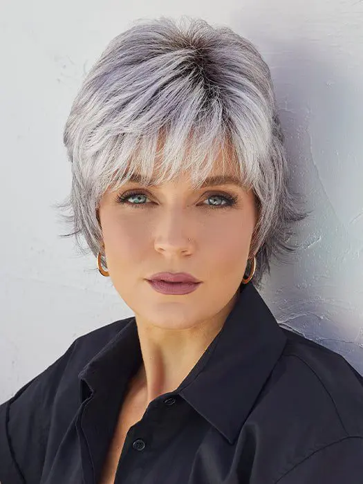 Woman with short silver hair, black shirt.