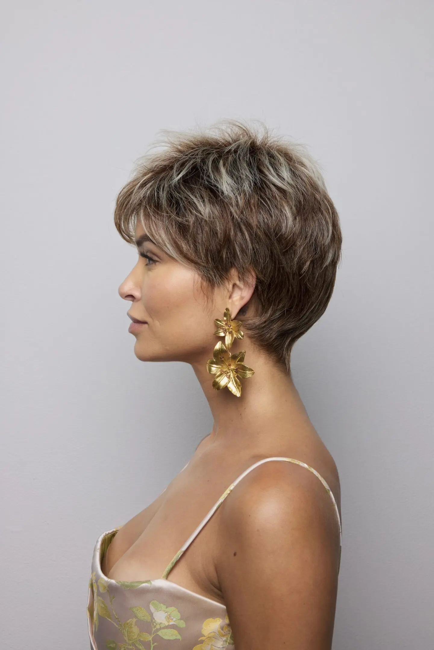 Profile of woman with short hair.