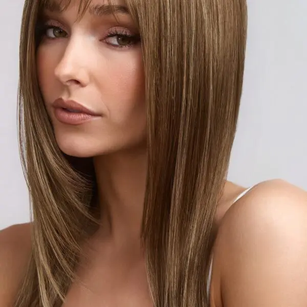 Woman with straight, brown hair and bangs.