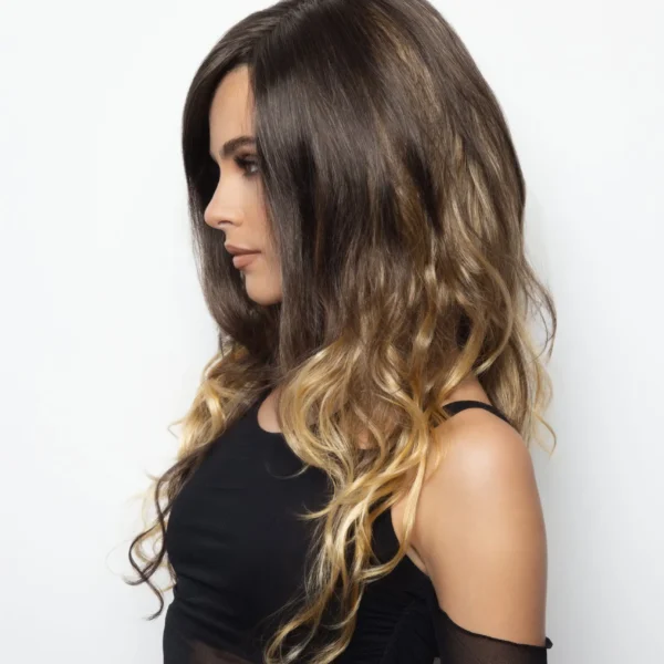 Woman with long, wavy hair in profile